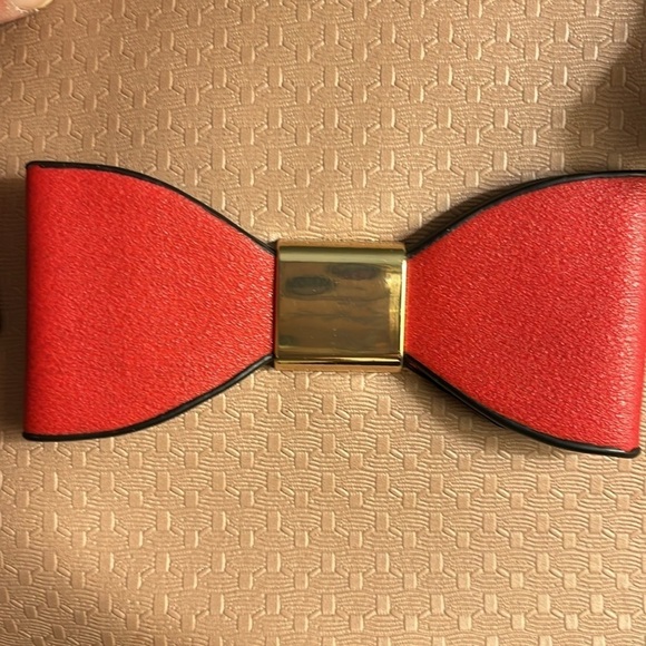 No Brand red bow purse. Black, tan, white, gray and beige design. Straps detach. - Picture 10 of 11